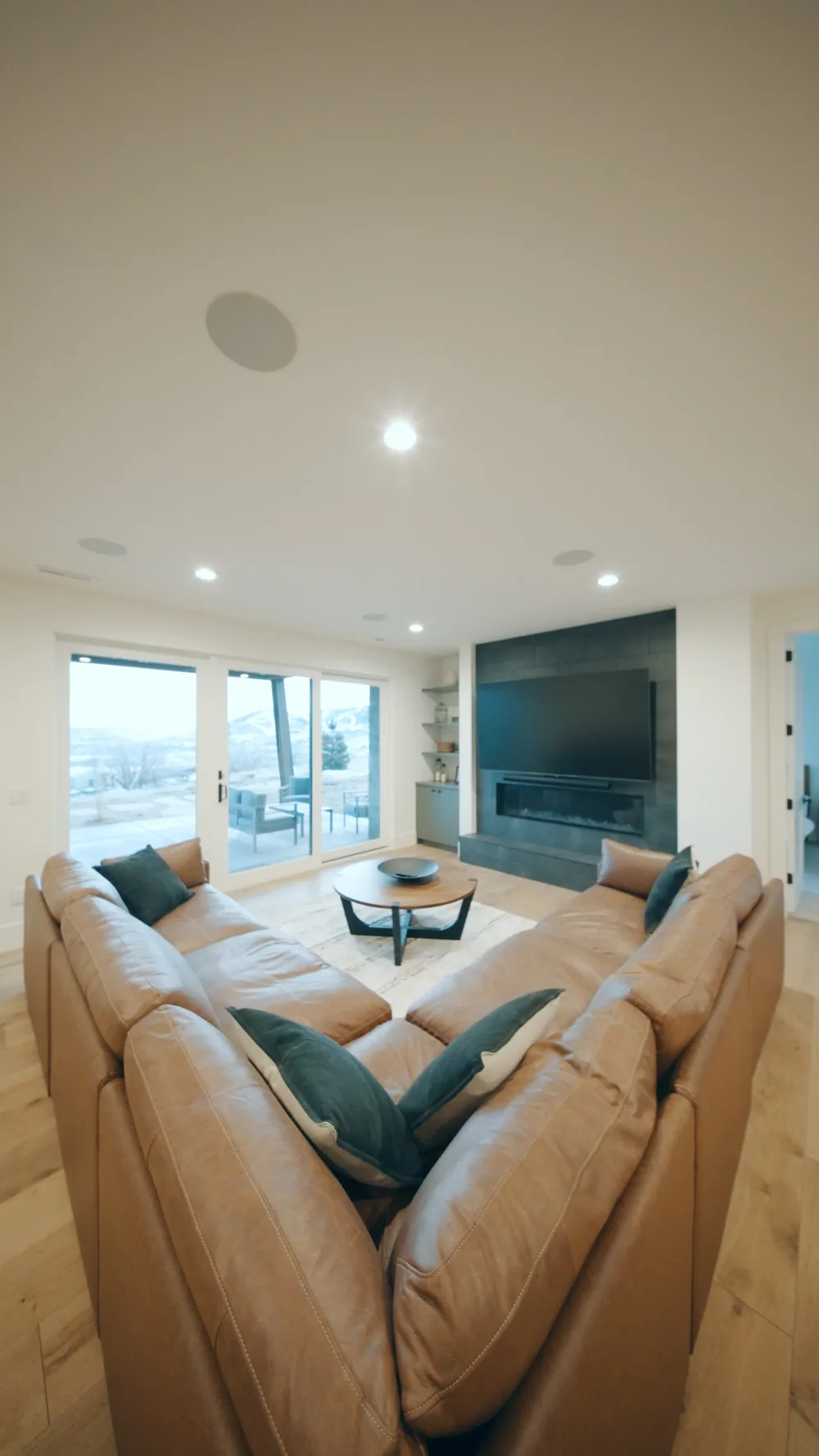 A leather sectional sofa in a bright living room.